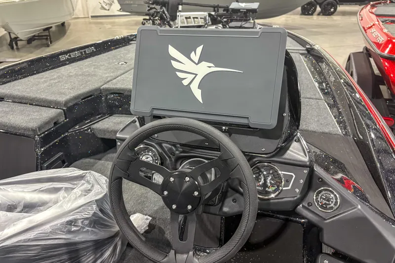 Slide: The Image of Steering console of 2026 Skeeter ZXR19 boat with modern dashboard and controls. - 12