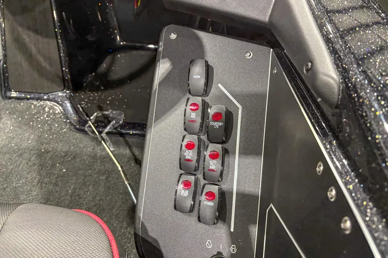 Slide: The Image of Control panel of 2026 Skeeter ZXR19 boat with labeled switches. - 13