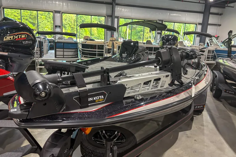 Slide: The Image of 2026 Skeeter ZXR19 boat with Minn Kota Ultrex motor in showroom. - 4