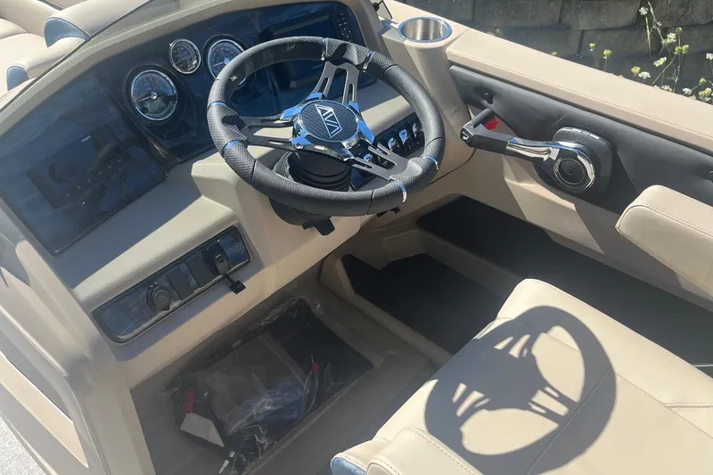 Slide: The Image of Interior of 2026 Avalon 21 LSZ Cruise boat with steering wheel and controls. - 3