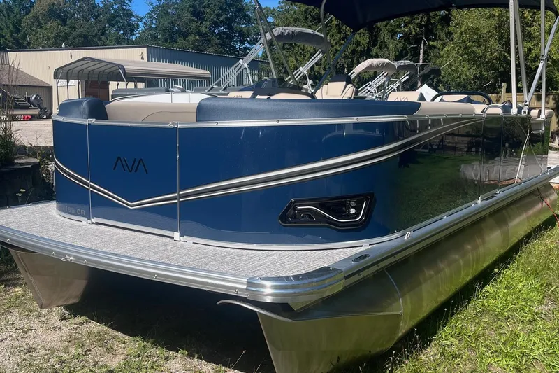 Slide: The Image of 2026 Avalon 21 LSZ Cruise pontoon boat, blue exterior, parked outdoors. - 5