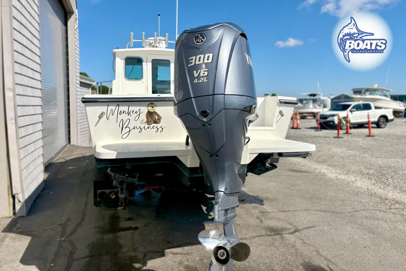 Slide: The Image of 2024 Parker 2320 SL Sport Cabin boat with Yamaha 300 V6 engine, "Monkey Business" text. - 12