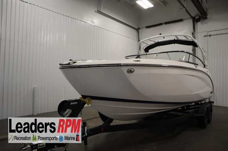 The Image of 2025 Yamaha Boats 252S in showroom, displayed on trailer, Leaders RPM branding visible. - 0