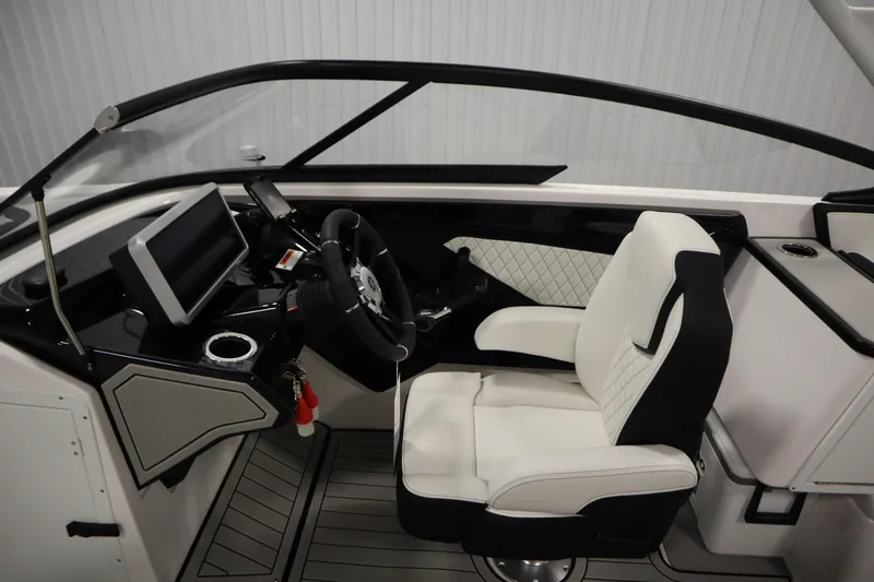 Slide: The Image of 2025 Yamaha Boats 252S cockpit with modern steering and luxurious seating. - 17