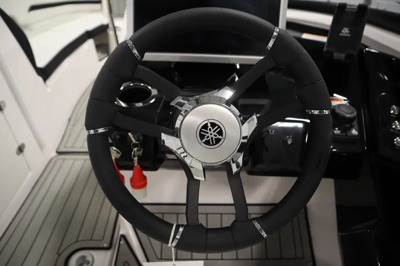 Slide: The Image of Steering wheel of 2025 Yamaha Boats 252S, featuring sleek design and modern controls. - 19