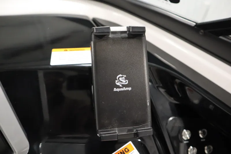 Slide: The Image of AquaAmp device on 2025 Yamaha Boats 252S dashboard, showcasing modern marine technology. - 21