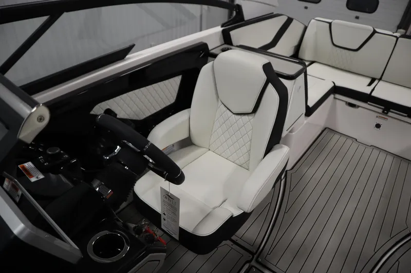 Slide: The Image of 2025 Yamaha Boats 252S interior with luxurious seating and modern steering console. - 26