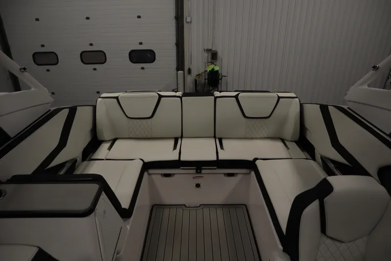 Slide: The Image of Luxurious interior seating of 2025 Yamaha Boats 252S, featuring elegant white and black upholstery. - 31