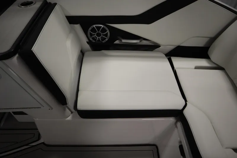 Slide: The Image of 2025 Yamaha Boats 252S interior seating with sleek white and black design. - 34