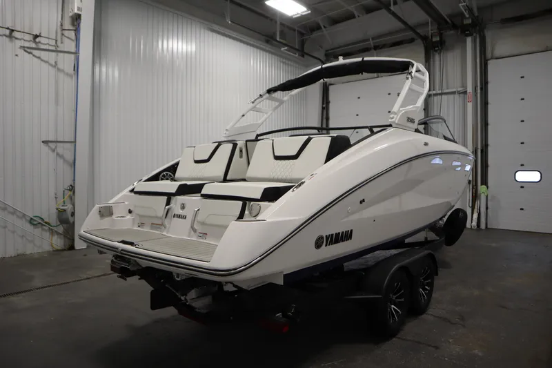 Slide: The Image of 2025 Yamaha Boats 252S in a garage, showcasing sleek design and modern features. - 4