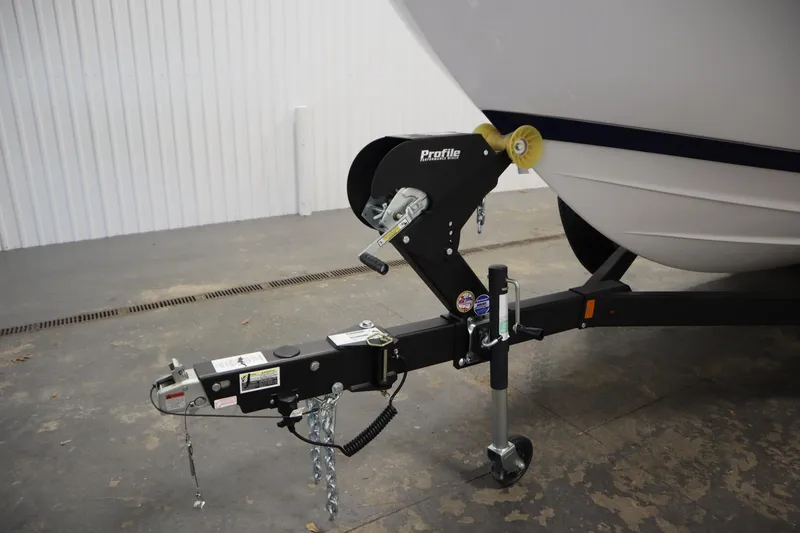 Slide: The Image of 2025 Yamaha Boats 252S trailer hitch in a garage setting. - 44