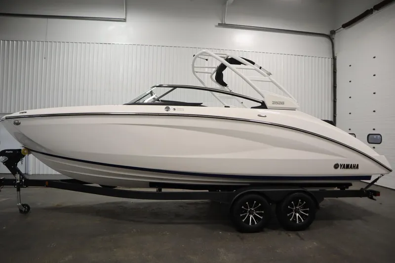 Slide: The Image of 2025 Yamaha Boats 252S on trailer in indoor showroom setting. - 7