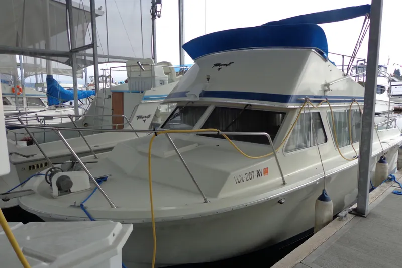 Slide: The Image of Boat deck with blue flooring, docked at marina, featuring safety equipment and nautical accessories. - 3