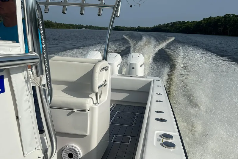 Slide: The Image of 2024 Contender 39 ST boat interior with helm, seating, and modern controls. - 21