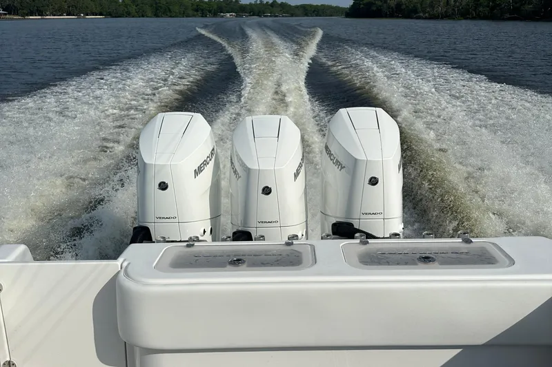 Slide: The Image of 2024 Contender 39 ST boat on trailer, equipped with multiple fishing rods. - 25