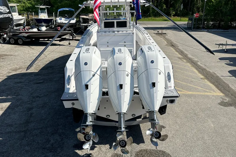 Slide: The Image of 2024 Contender 39 ST boat anchor compartment with open hatch, showcasing sleek design. - 3