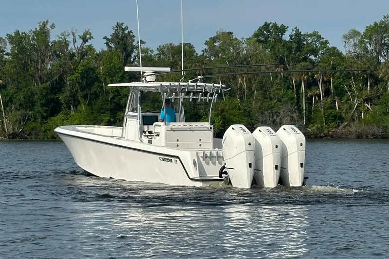 Slide: The Image of 2024 Contender 39 ST boat console with steering wheel and navigation equipment. - 5