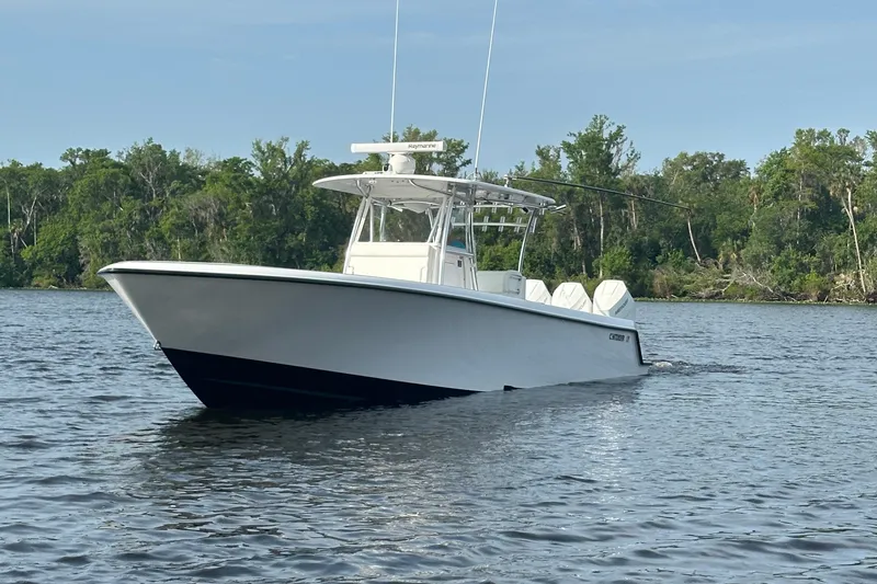 Slide: The Image of 2024 Contender 39 ST boat interior with open storage compartments and sleek design. - 8