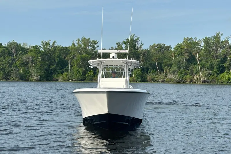 Slide: The Image of 2024 Contender 39 ST boat with open storage compartment on deck. - 9