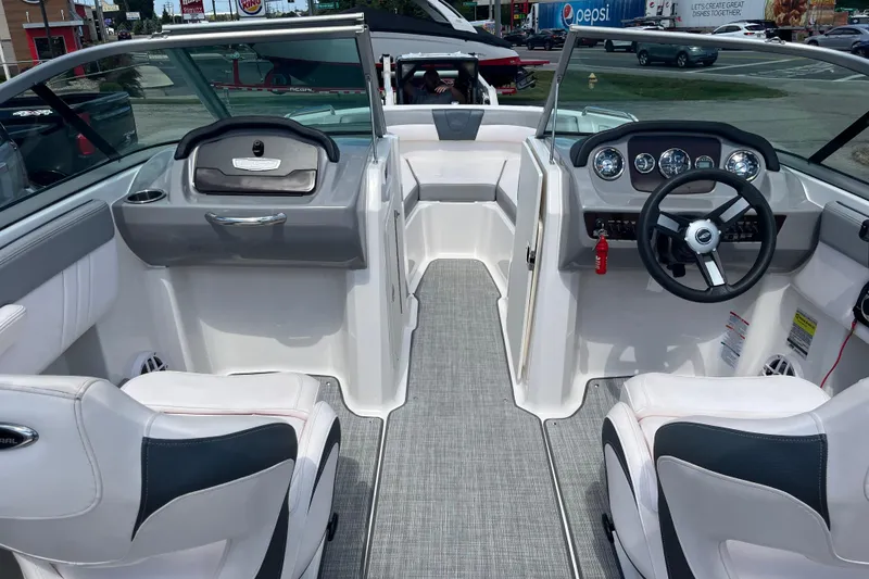 Slide: The Image of 2021 Chaparral 21 SSi boat interior with modern dashboard and seating. - 1
