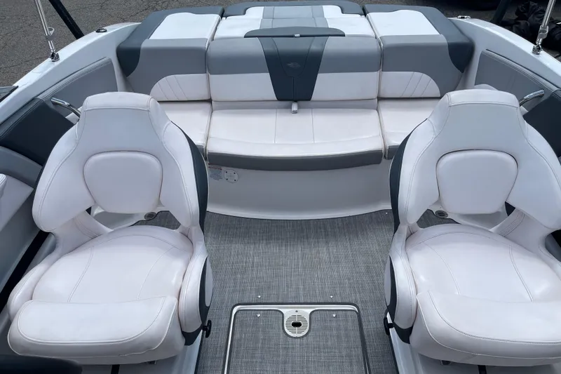 Slide: The Image of 2021 Chaparral 21 SSi boat interior with white and gray seating arrangement. - 10