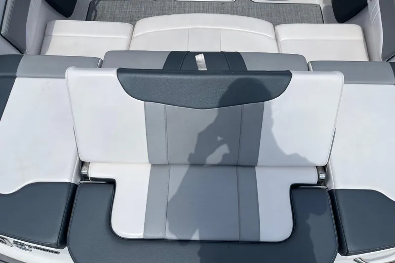 Slide: The Image of 2021 Chaparral 21 SSi boat interior with gray and white seating. - 12