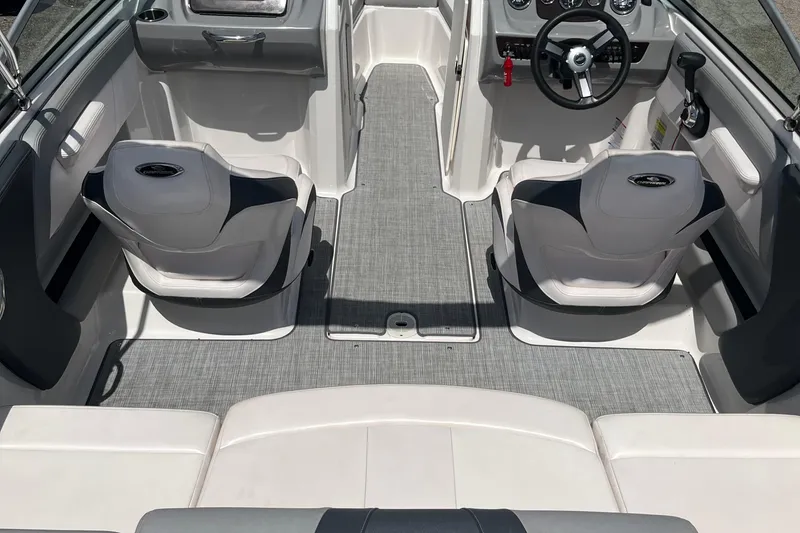 Slide: The Image of Interior of 2021 Chaparral 21 SSi boat with modern seating and steering wheel. - 19