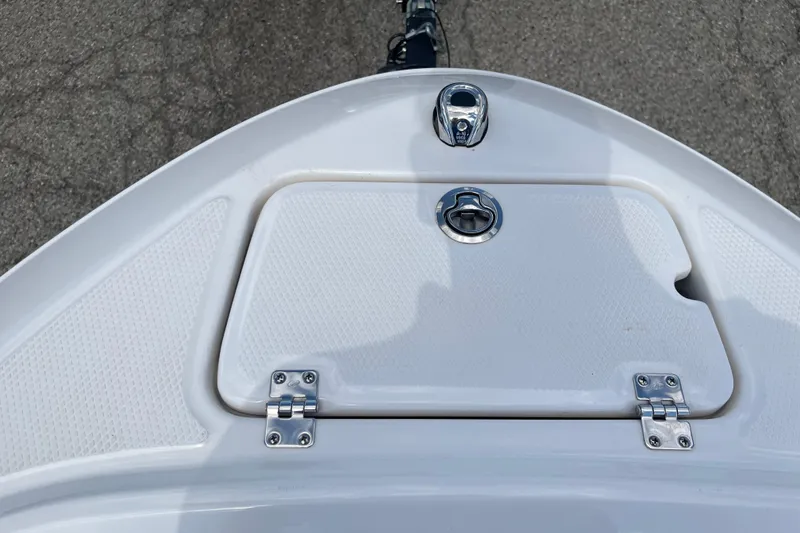 Slide: The Image of Bow of 2021 Chaparral 21 SSi boat with storage compartment and cleat. - 3