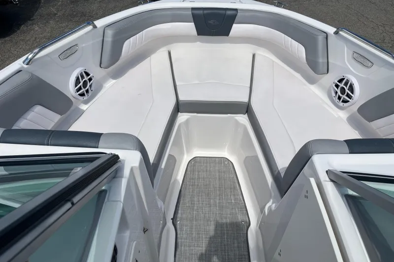 Slide: The Image of 2021 Chaparral 21 SSi boat interior with gray seating and speakers. - 8