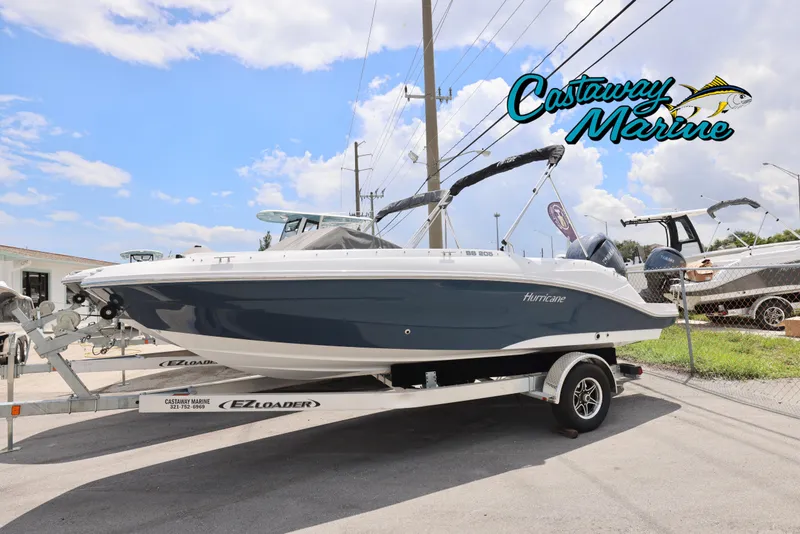 The Image of 2026 Hurricane SunDeck Sport 205 OB boat on trailer at Castaway Marine dealership. - 0
