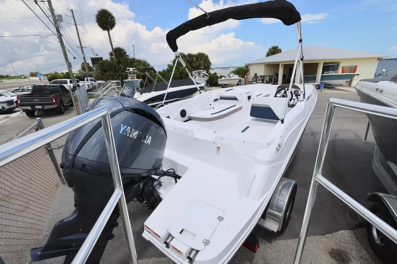 Slide: The Image of 2026 Hurricane SunDeck Sport 205 OB boat interior with white seating and blue accents. - 15