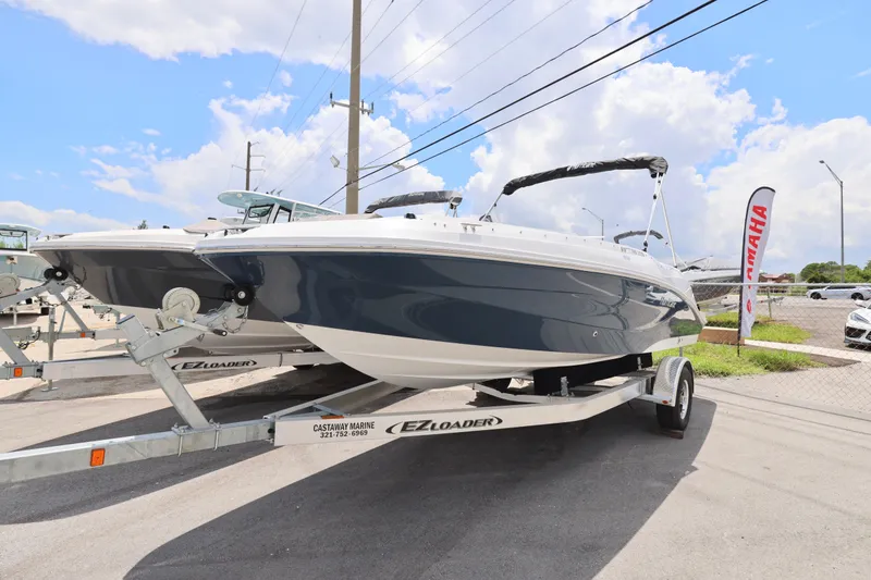 Slide: The Image of 2026 Hurricane SunDeck Sport 205 OB boat with Yamaha outboard motor on trailer. - 16