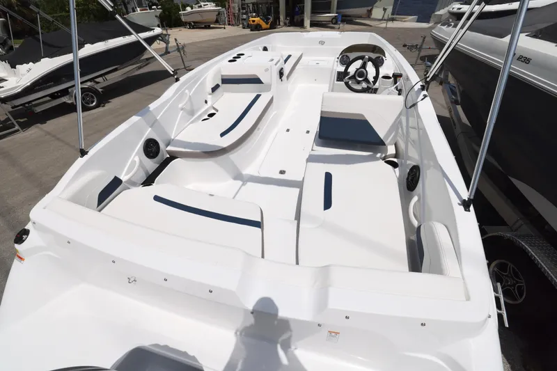 Slide: The Image of 2026 Hurricane SunDeck Sport 205 OB boat interior with spacious seating and modern design. - 2