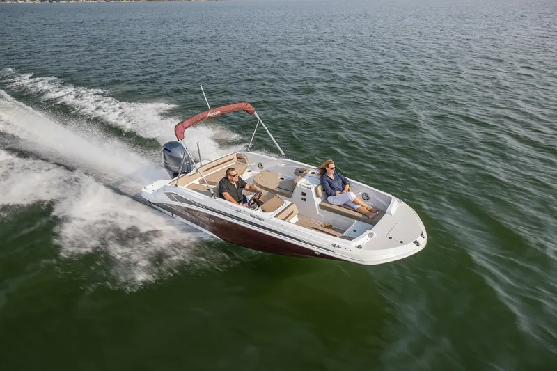 Slide: The Image of 2025 Hurricane SunDeck Sport 205 OB cruising on open water, showcasing sleek design and performance. - 29