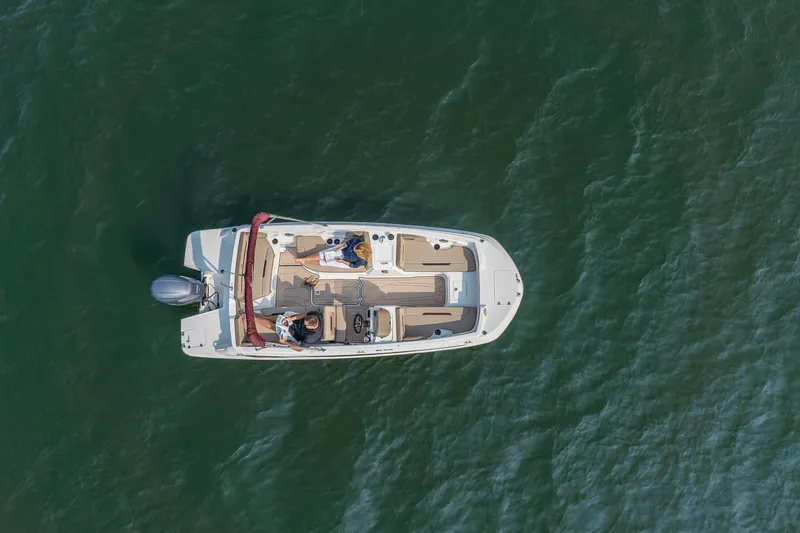 Slide: The Image of 2025 Hurricane SunDeck Sport 205 OB cruising on open water. - 30