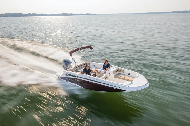Slide: The Image of 2025 Hurricane SunDeck Sport 205 OB cruising on a serene lake. - 36