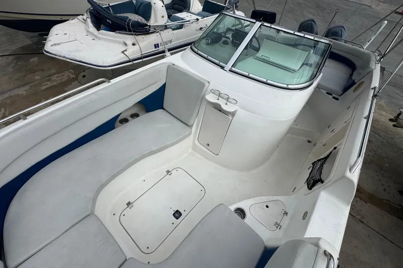 Slide: The Image of 2004 Hurricane 2600 boat interior with seating and storage compartments. - 14