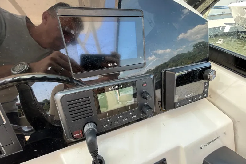 Slide: The Image of Dashboard of 2022 Cobia 240 Dual Console with Yamaha and Garmin displays. - 5