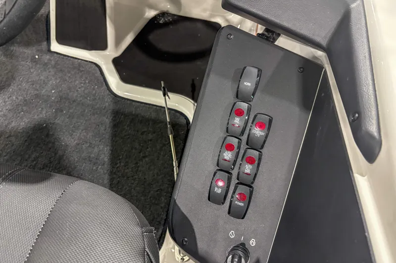 Slide: The Image of Control panel of 2020 Skeeter ZXR20 SE boat with various switches and buttons. - 12