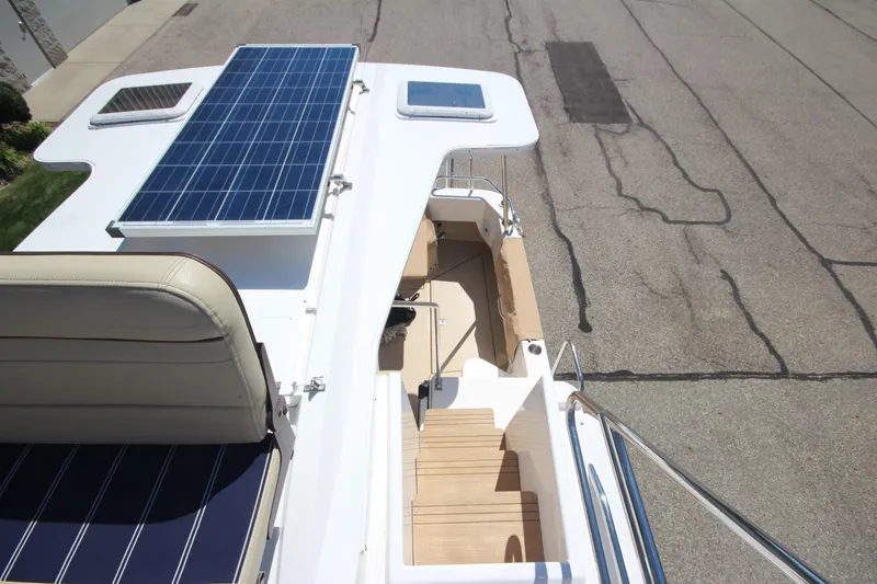 Slide: The Image of 2020 Ranger Tugs R-31 Command Bridge LE with solar panels on deck. - 16