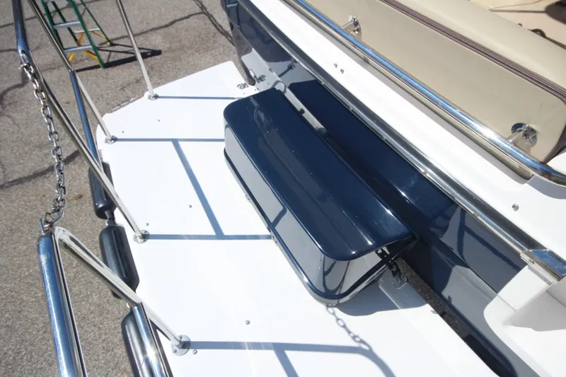 Slide: The Image of 2020 Ranger Tugs R-31 Command Bridge LE, rear deck view with seating and railing. - 19