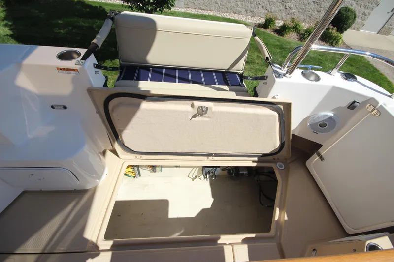 Slide: The Image of 2020 Ranger Tugs R-31 Command Bridge LE, open storage compartment view. - 26