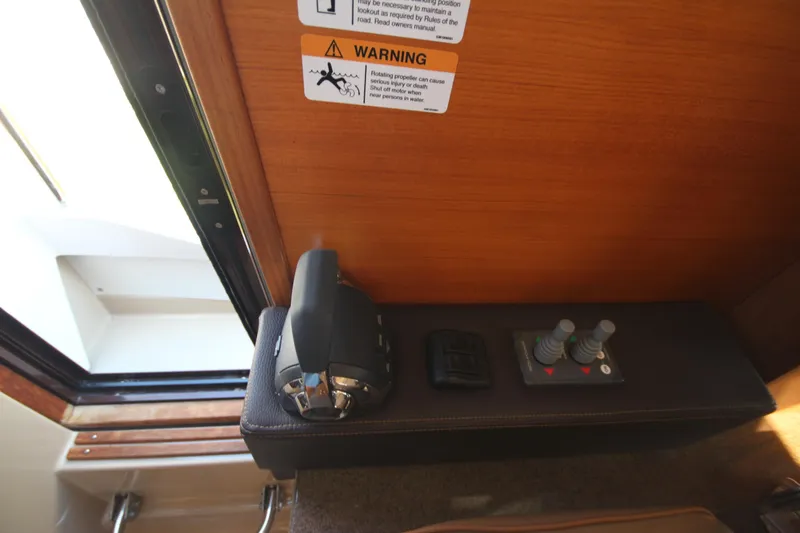 Slide: The Image of 2020 Ranger Tugs R-31 Command Bridge LE control panel with warning label. - 43