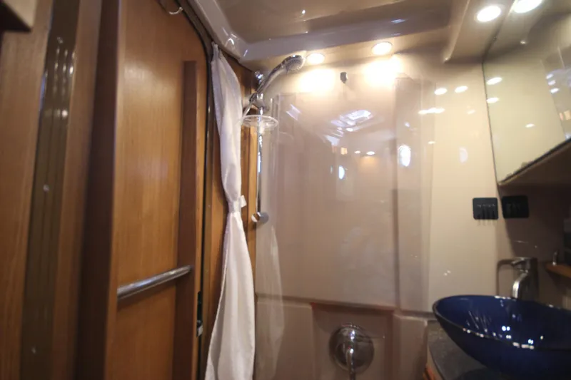 Slide: The Image of 2020 Ranger Tugs R-31 Command Bridge LE bathroom with shower and modern sink. - 49