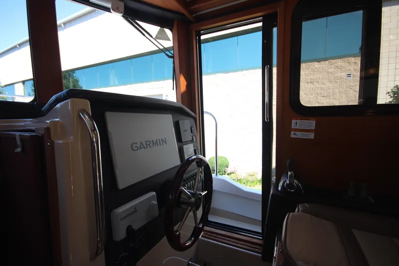 Slide: The Image of 2020 Ranger Tugs R-31 Command Bridge LE interior with Garmin navigation system. - 41