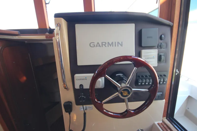 Slide: The Image of 2020 Ranger Tugs R-31 Command Bridge LE helm with Garmin navigation system. - 42