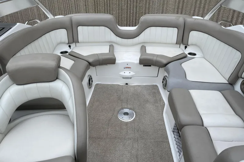 Slide: The Image of 2009 Yamaha Boats 232 Limited S interior with beige and white seating. - 12