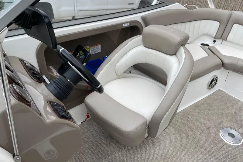 Slide: The Image of 2009 Yamaha Boats 232 Limited S interior with steering wheel and seating area. - 15
