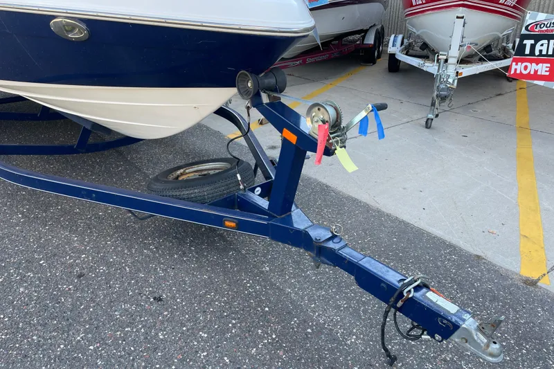 Slide: The Image of Trailer for 2009 Yamaha Boats 232 Limited S, parked on asphalt. - 9