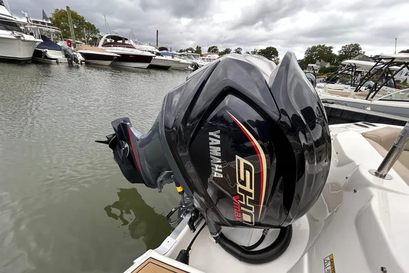 Slide: The Image of 2022 NauticStar 243 DC with Yamaha SHO outboard motor at marina. - 10